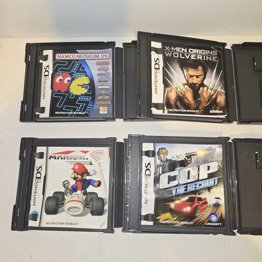 LOT OF 4 NINTENDO DS CASES AND MANUALS ONLY - NO GAMES. Mariokart  Wolverine